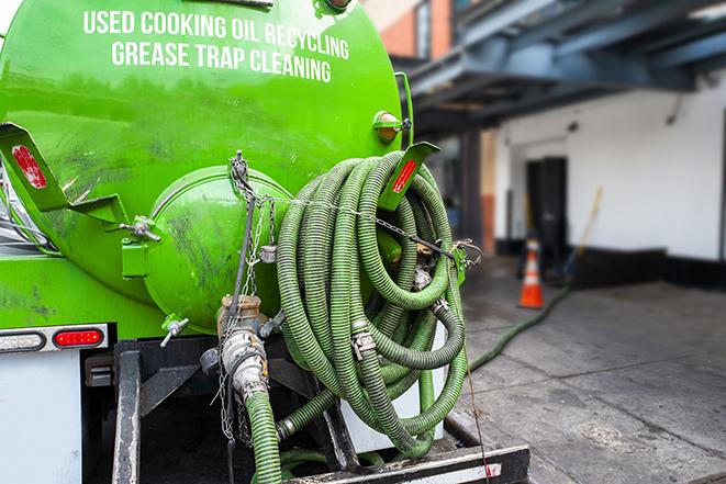 truck pumping out a large grease trap in Christmas